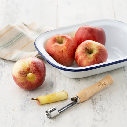 Wooden Apple Corer with a beech handle shown with some rosey red apples