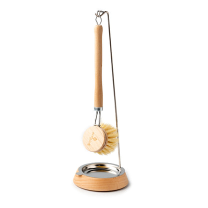 Dishbrush shown hanging from holder to be used to dry the brush between uses